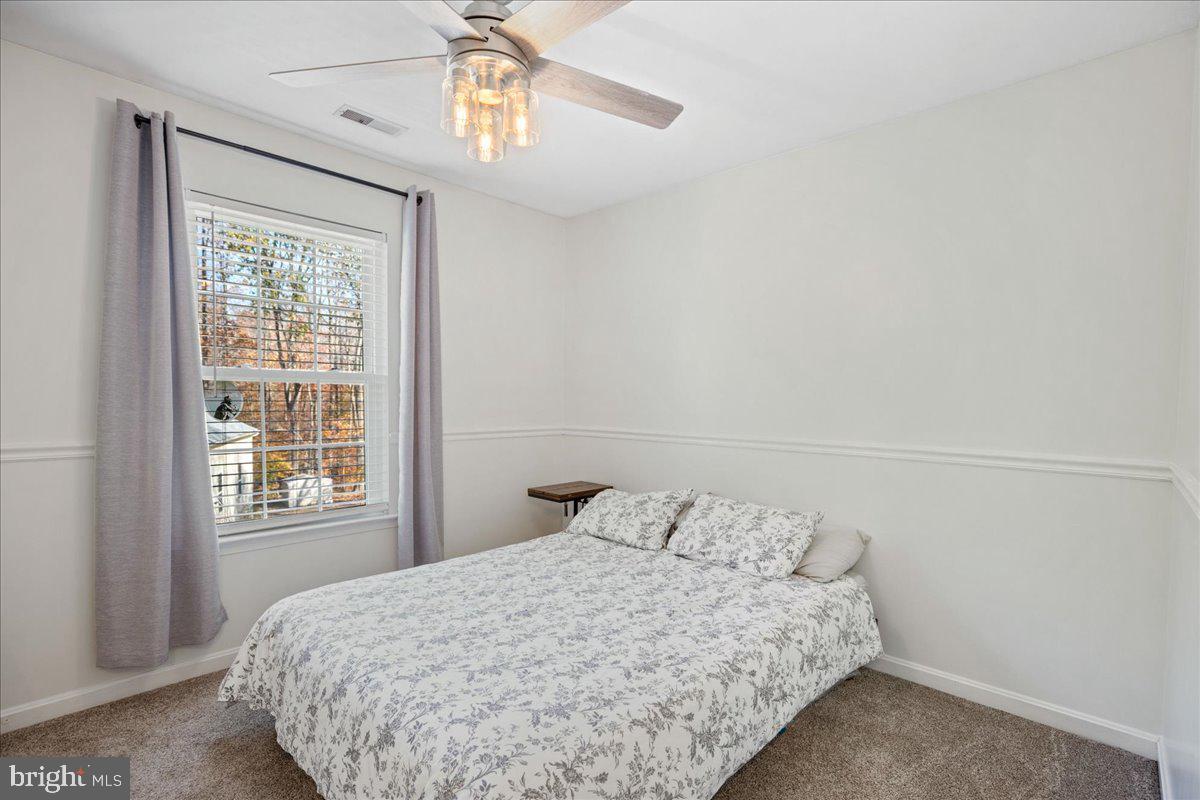1755 Lottie Fowler Road Prince Frederick, MD 20678 - Photo 50 of 76 a bedroom with a bed and a window