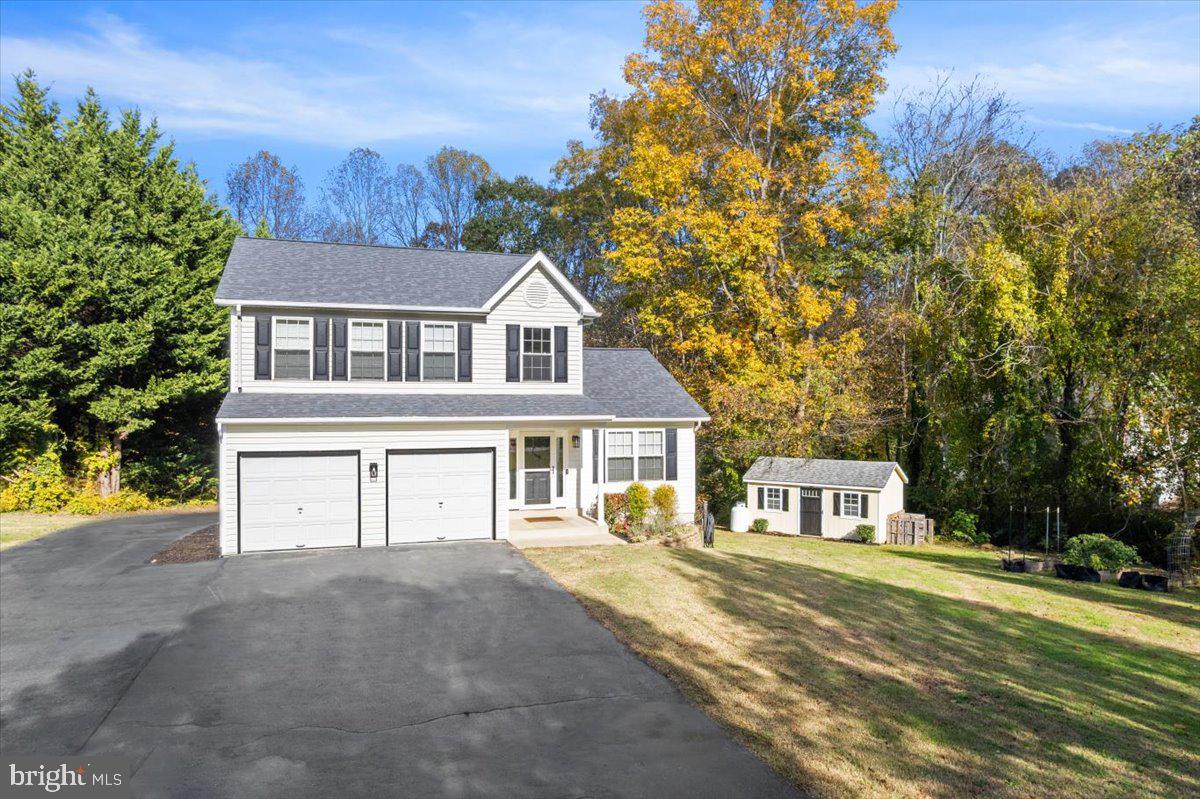 1755 Lottie Fowler Road Prince Frederick, MD 20678 - Photo 56 of 76 a front view of a house with a yard