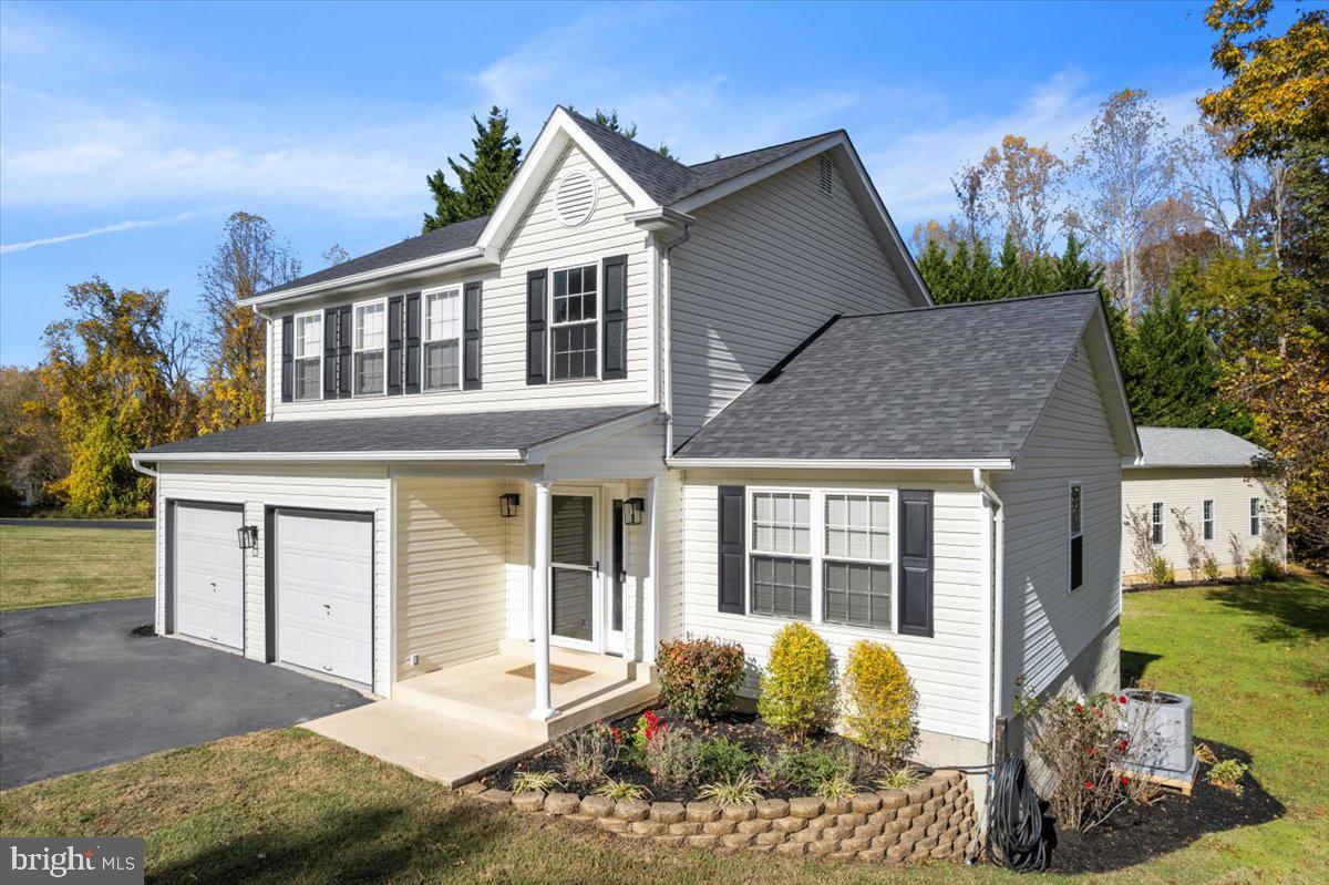 1755 Lottie Fowler Road Prince Frederick, MD 20678 - Photo 6 of 76 a front view of a house with a yard