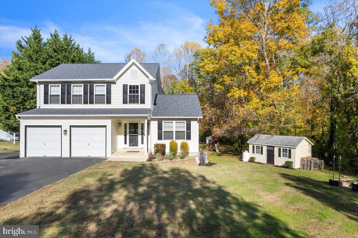 1755 Lottie Fowler Road Prince Frederick, MD 20678 - Photo 8 of 76 a front view of a house with a yard