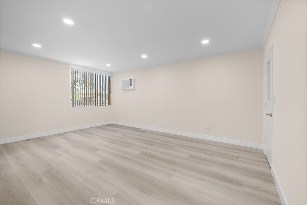 1485 East Wilson Avenue, Unit M Glendale, CA 91206 - Photo 4 of 19 an empty room with wooden floor and windows