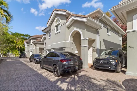 a front view of a house with parking