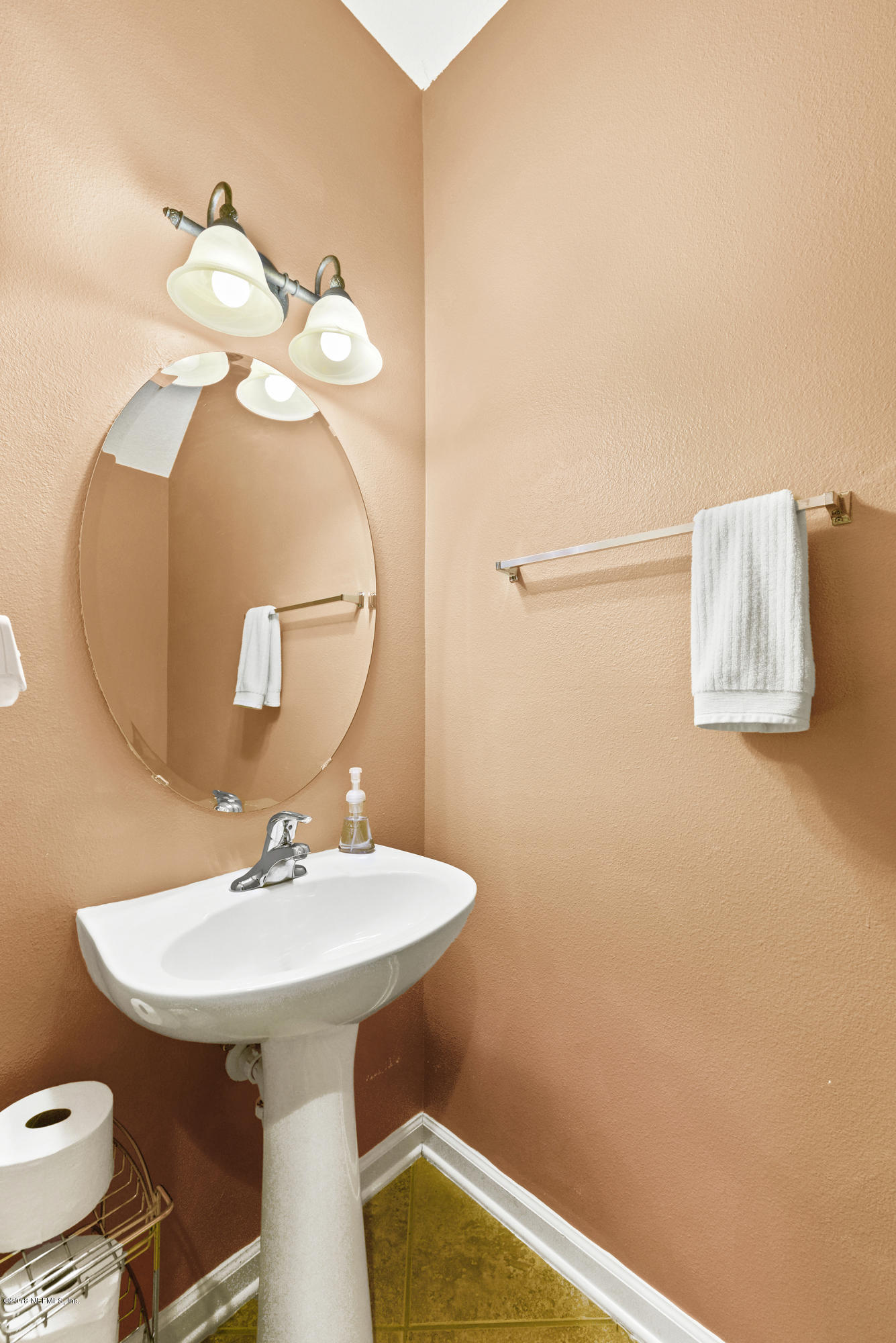 12996 Spring Rain Road Jacksonville, FL 32258 - Photo 12 of 15 a bathroom with a sink and a mirror