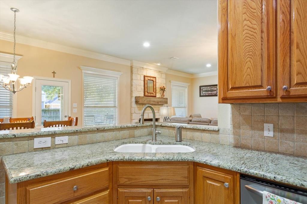 5620 Landsdown Drive Waco, TX 76708 - Photo 15 of 37 a kitchen with stainless steel appliances granite countertop a sink and a granite counter tops