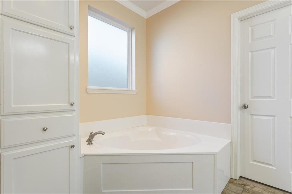 5620 Landsdown Drive Waco, TX 76708 - Photo 19 of 37 a bathroom with a sink and a shower