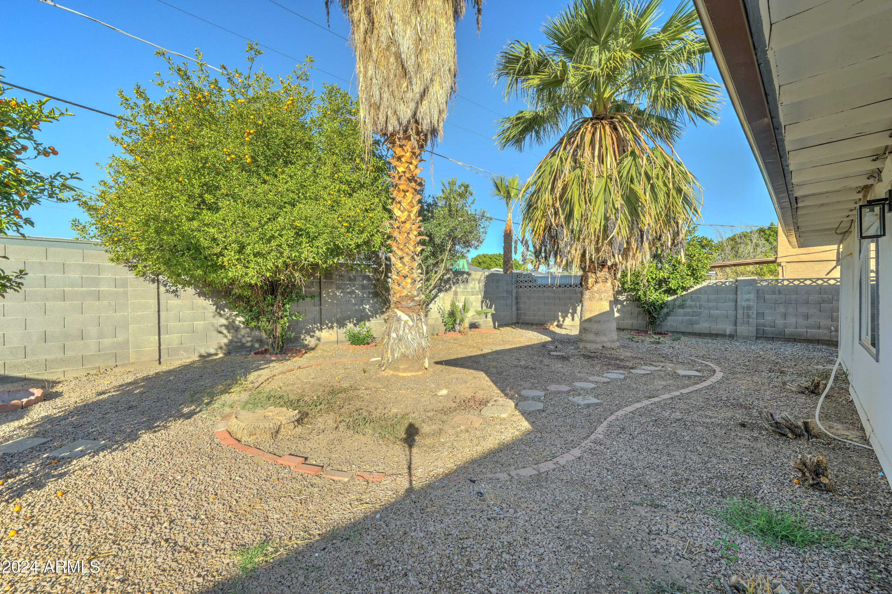 4522 North 14th Avenue Phoenix, AZ 85013 - Photo 34 of 36 a backyard of a house with table and chairs