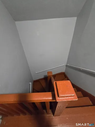 view of an empty room with wooden floor