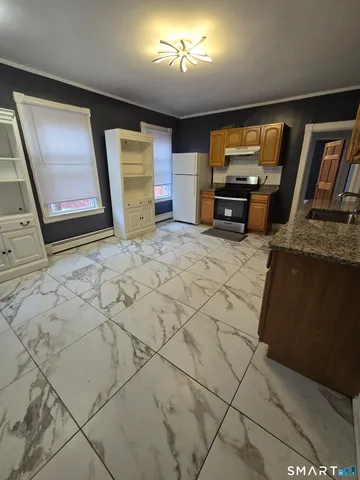 a view of a livingroom with furniture and a flat screen tv