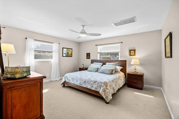 a bedroom with a bed and a dresser in it