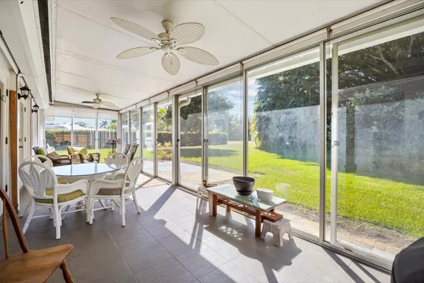 a house view with swimming pool and garden space