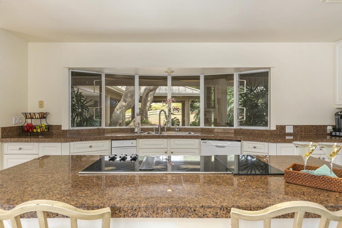 59-1764 Kohala Ranch Road Kamuela, HI 96743 - Photo 15 of 30 a large white kitchen with a large window