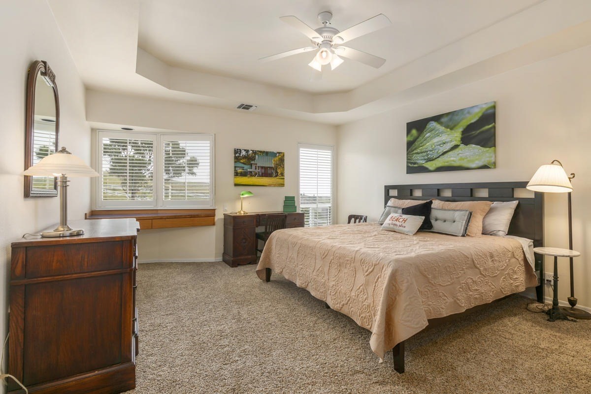 59-1764 Kohala Ranch Road Kamuela, HI 96743 - Photo 19 of 30 a bedroom with a bed and dresser with mirror