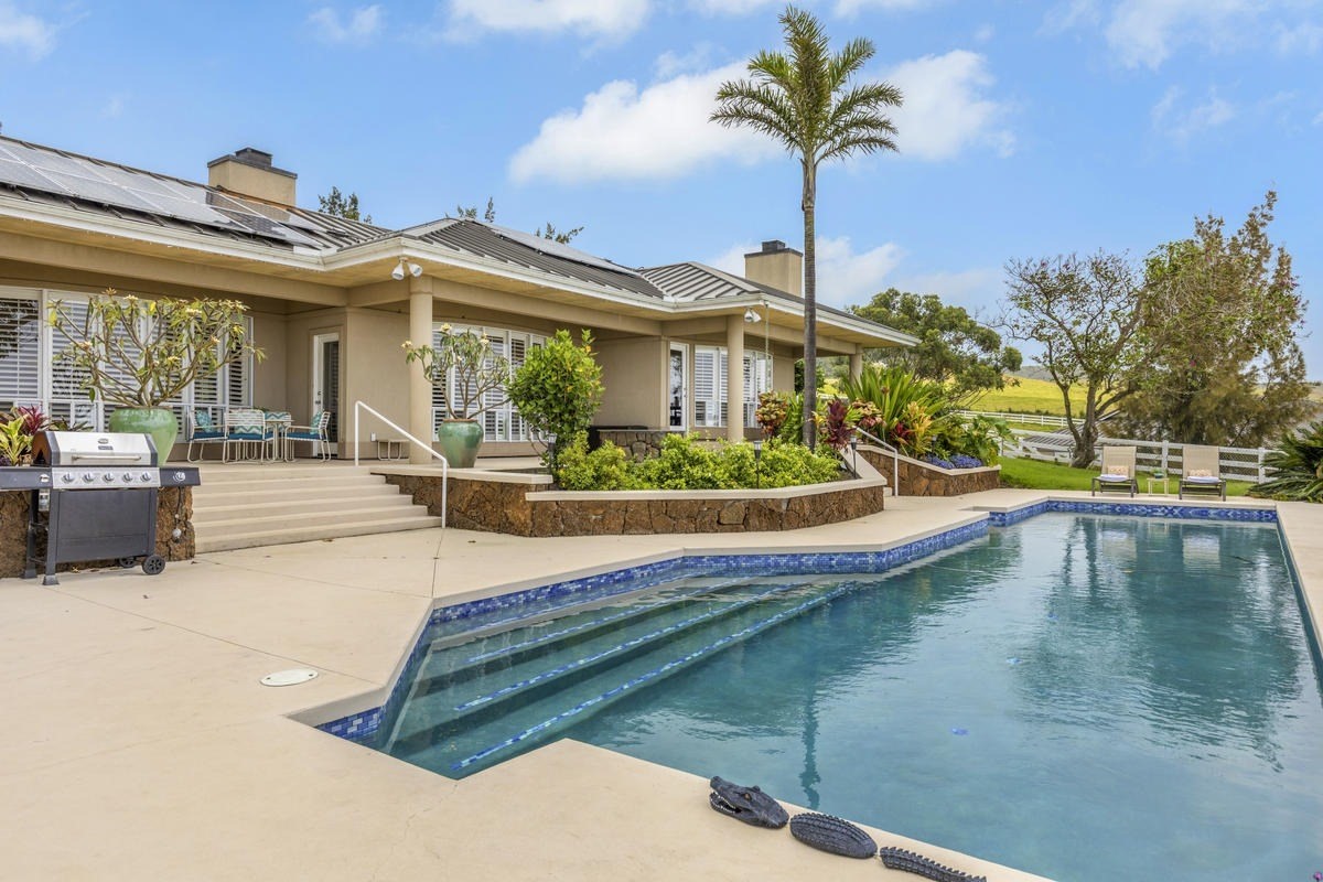 59-1764 Kohala Ranch Road Kamuela, HI 96743 - Photo 24 of 30 a view of a house with a swimming pool