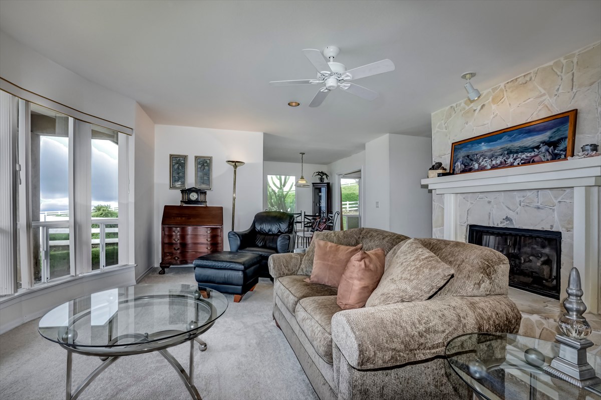59-1764 Kohala Ranch Road Kamuela, HI 96743 - Photo 29 of 30 a living room with furniture and a fireplace