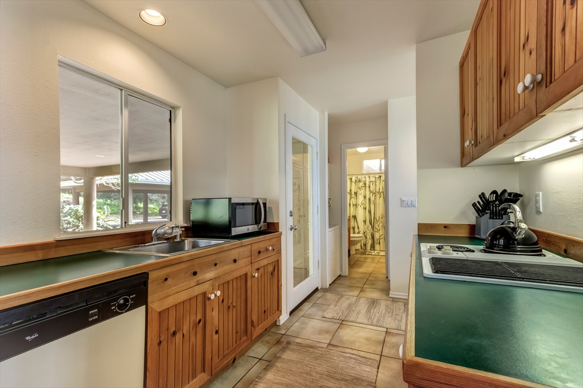 59-1764 Kohala Ranch Road Kamuela, HI 96743 - Photo 30 of 30 a kitchen with stainless steel appliances kitchen island granite countertop a sink and a stove