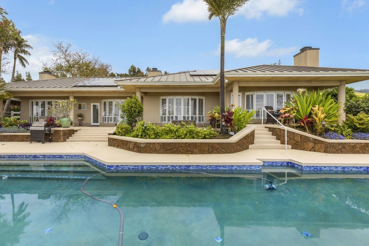 59-1764 Kohala Ranch Road Kamuela, HI 96743 - Photo 4 of 30 a front view of a house with swimming pool having outdoor seating