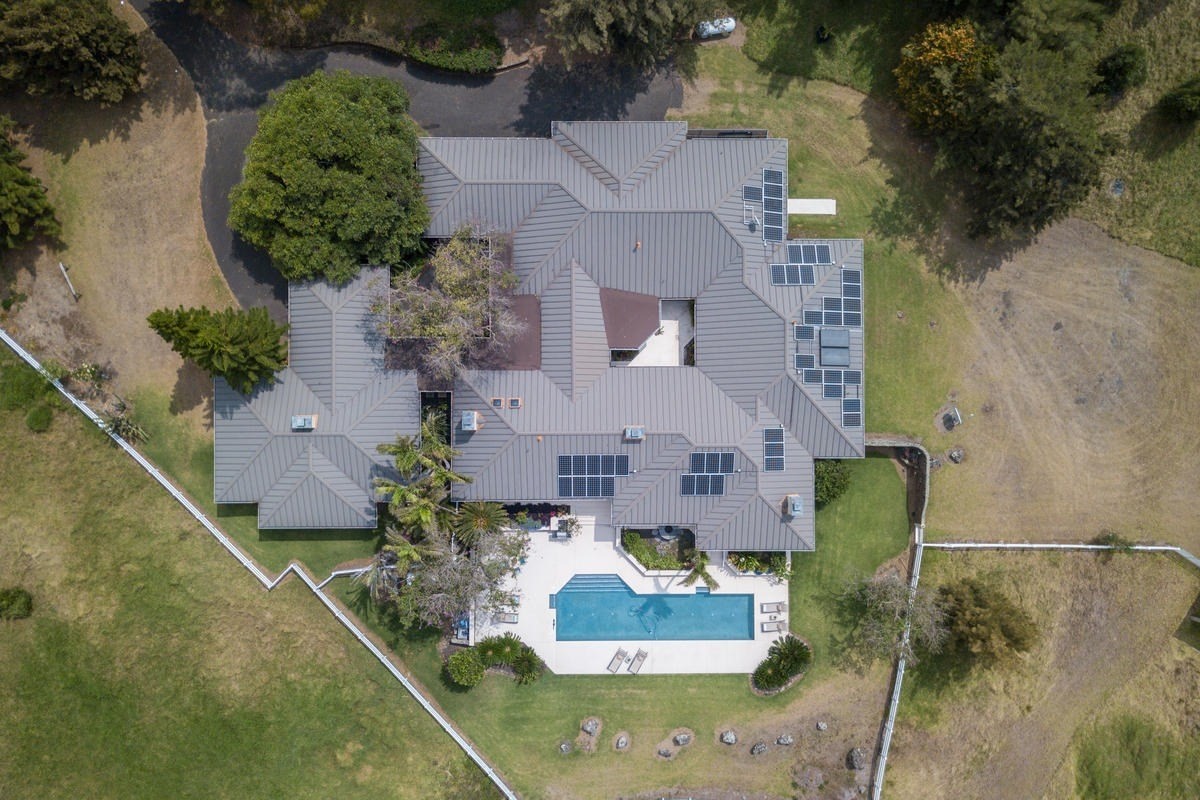 59-1764 Kohala Ranch Road Kamuela, HI 96743 - Photo 5 of 30 an aerial view of a house with a yard and a fountain