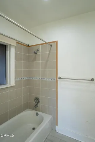 a bathroom with a shower and a bathtub