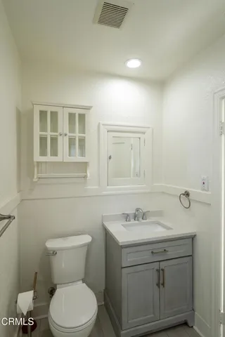 a bathroom with a sink toilet and vanity