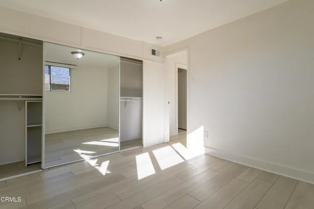 a view of entryway with wooden floor