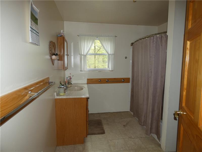 253 Cokain Road Harrisville, PA 16038 - Photo 13 of 25 Full bathroom on the main floor