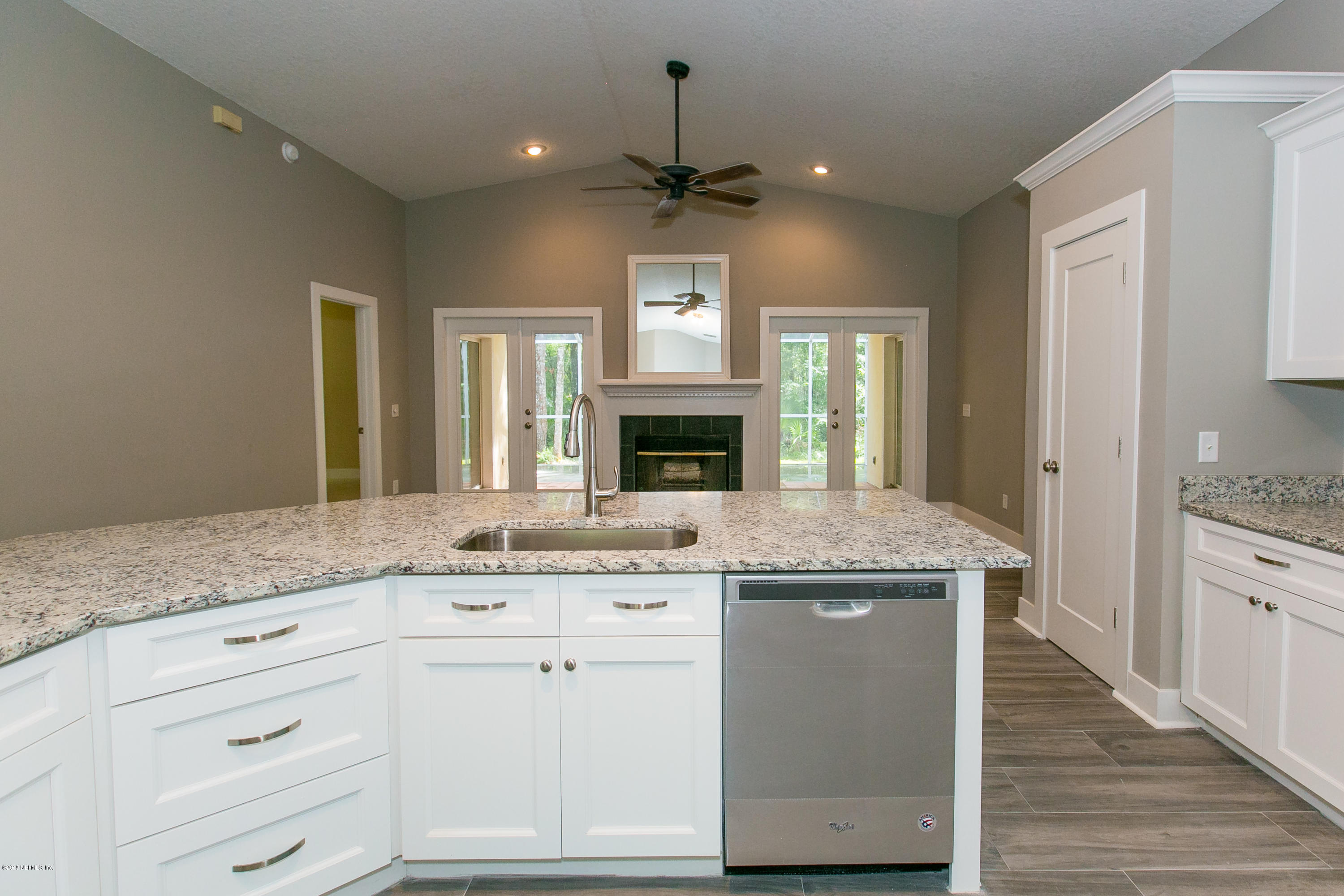 2225 Pacetti Road St. Augustine, FL 32092 - Photo 14 of 42 a kitchen with granite countertop a sink cabinets and stainless steel appliances