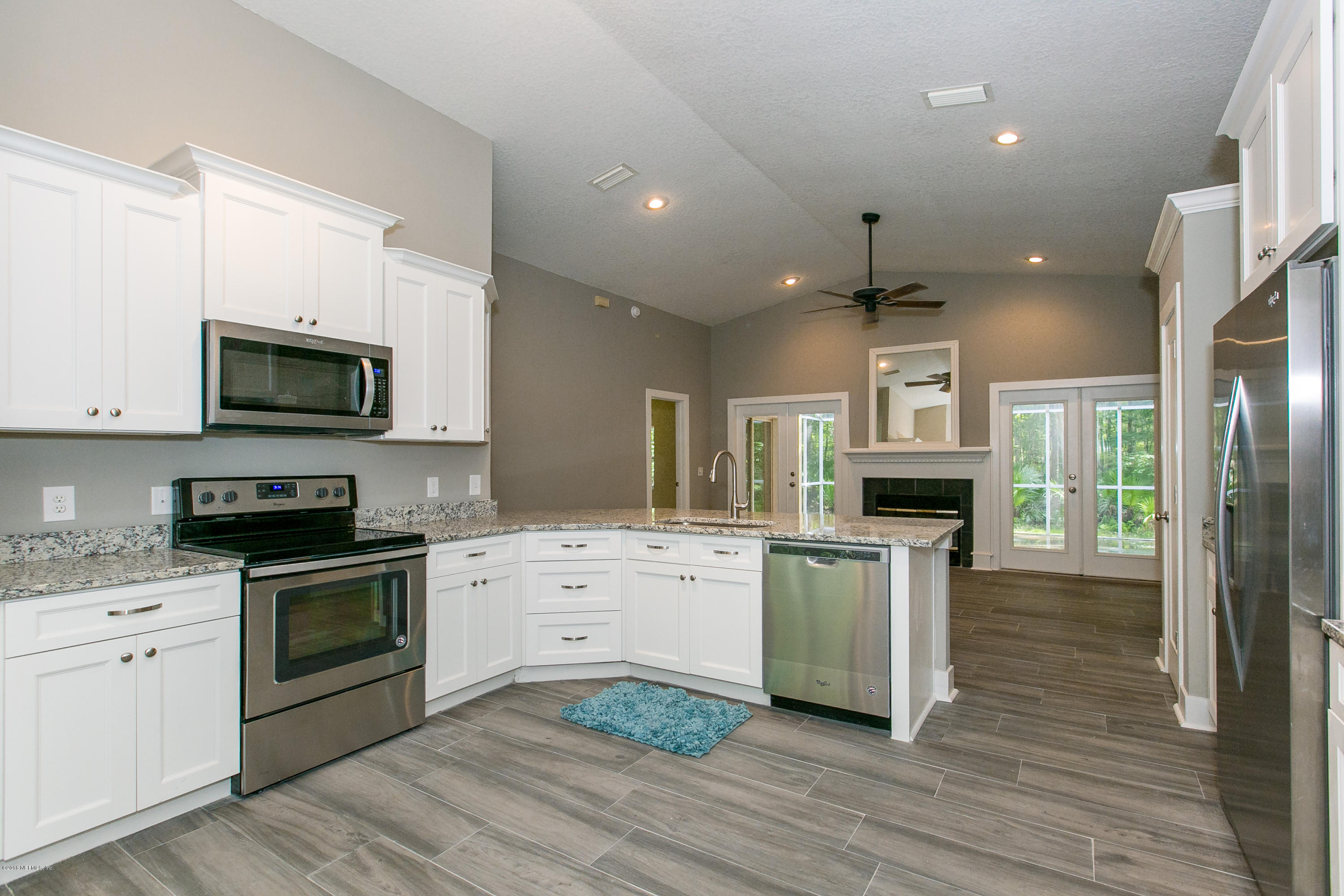 2225 Pacetti Road St. Augustine, FL 32092 - Photo 2 of 42 a kitchen with a sink stainless steel appliances and cabinets