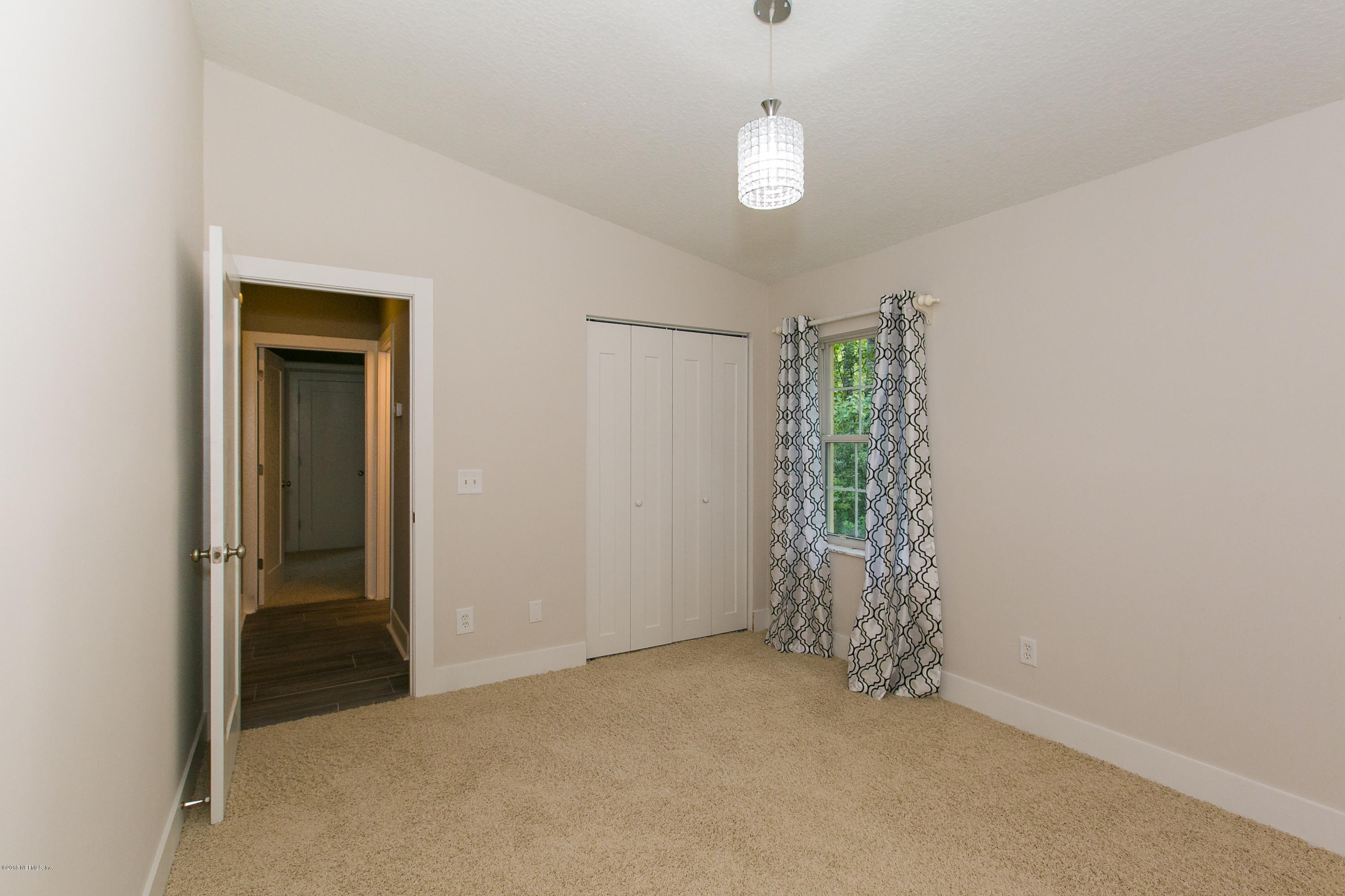 2225 Pacetti Road St. Augustine, FL 32092 - Photo 32 of 42 an empty room with windows