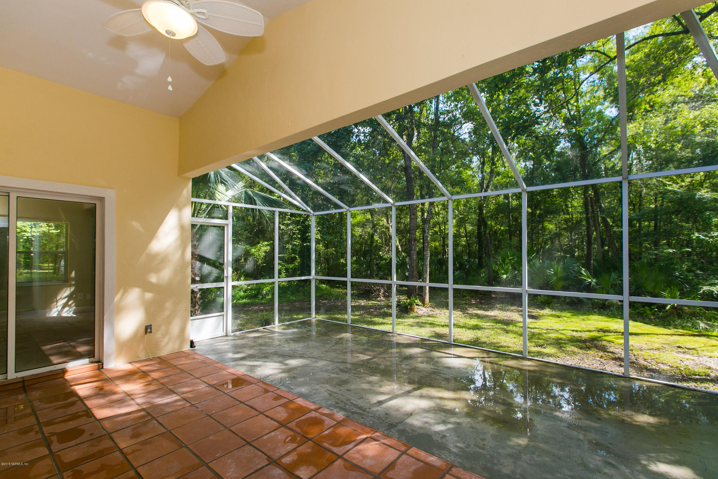 2225 Pacetti Road St. Augustine, FL 32092 - Photo 4 of 42 a view of a room with floor to ceiling windows and yard