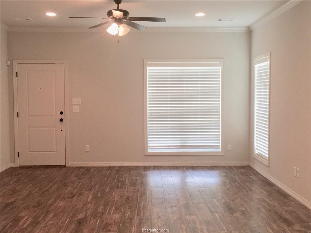 109 Ehlinger Drive Bryan, TX 77801 - Photo 25 of 25 an empty room with wooden floor closet fan and windows