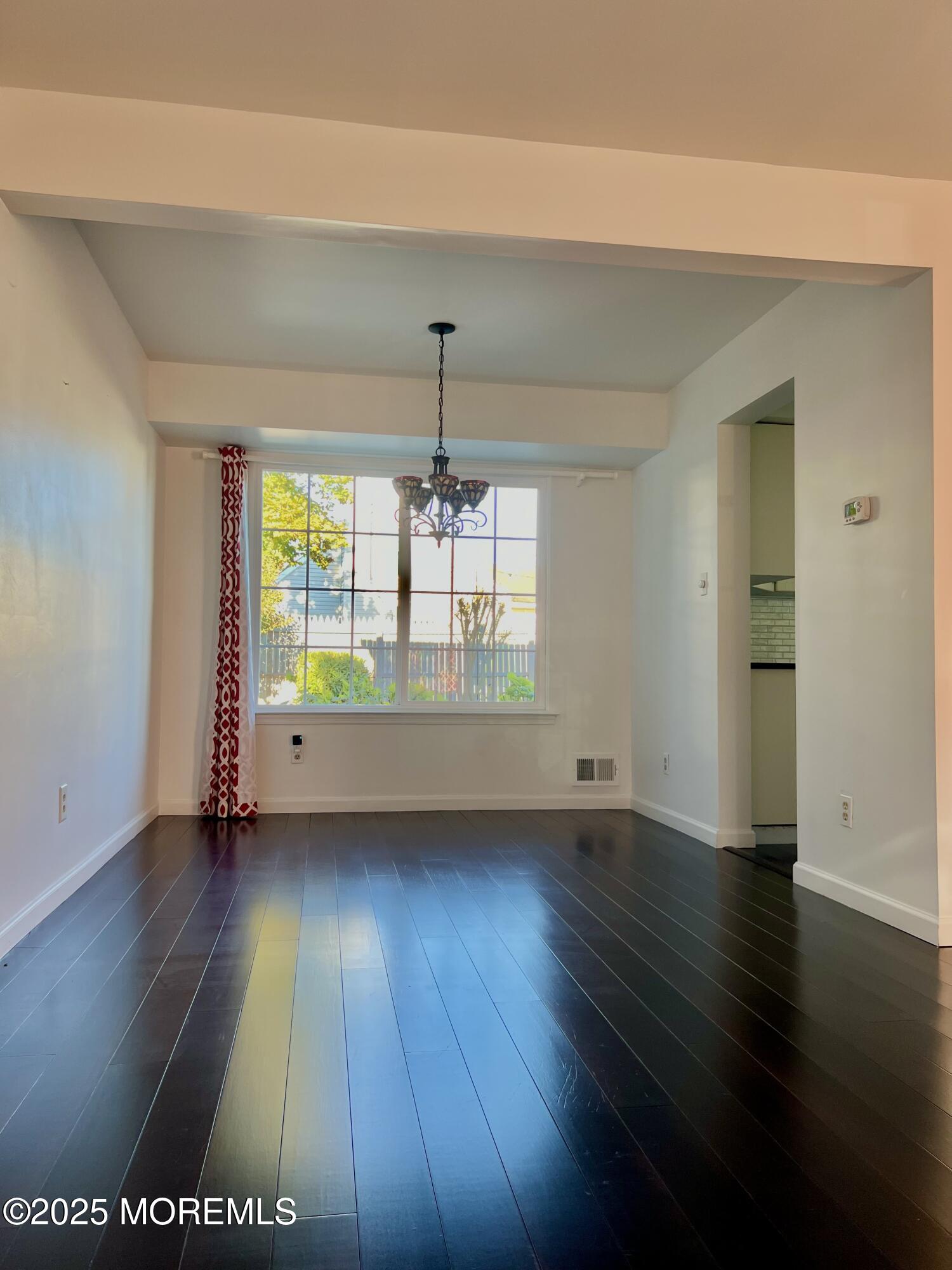 8 Hedgewood Road Howell, NJ 07731 - Photo 12 of 17 an empty room with wooden floor and windows