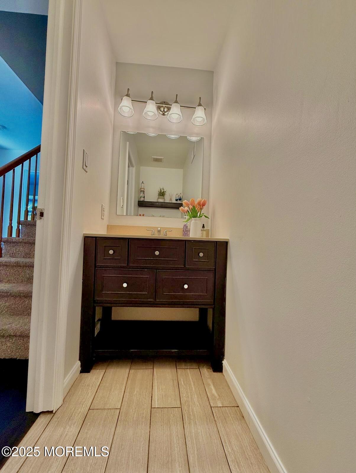 8 Hedgewood Road Howell, NJ 07731 - Photo 17 of 17 a bathroom with a sink and a mirror
