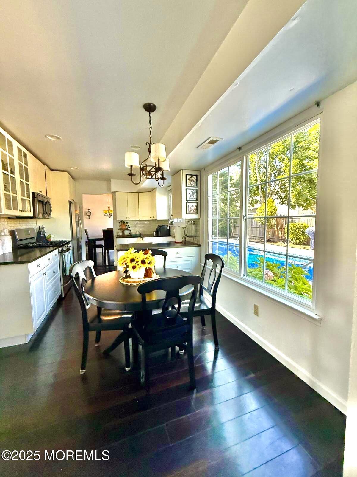 8 Hedgewood Road Howell, NJ 07731 - Photo 7 of 17 a view of a dining room with furniture window and wooden floor