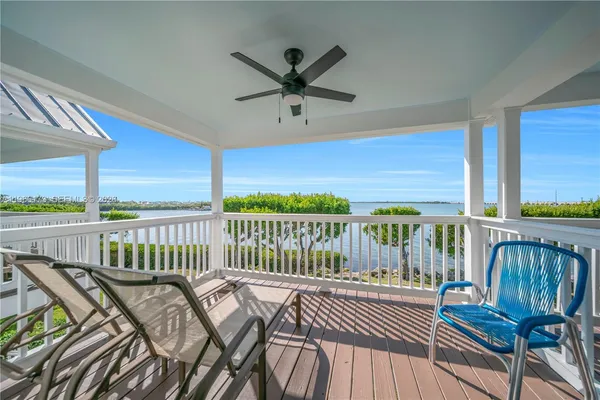 a view of a house with wooden deck