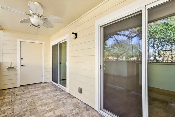 a view of a hallway with a glass door