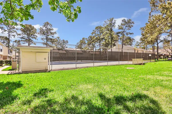 a view of a yard with a house in the background