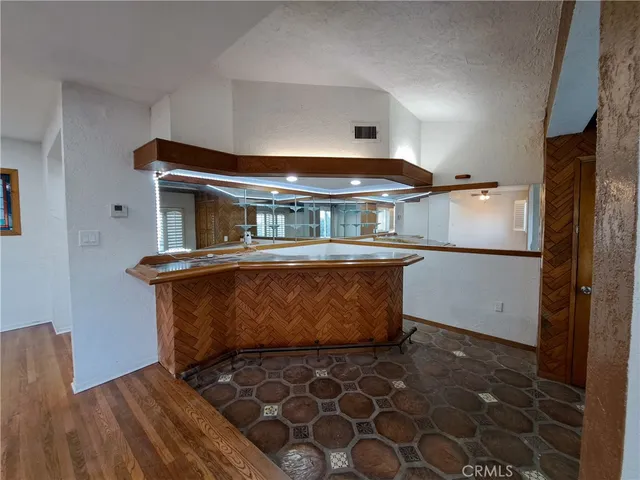 a kitchen with stainless steel appliances granite countertop a sink and cabinets