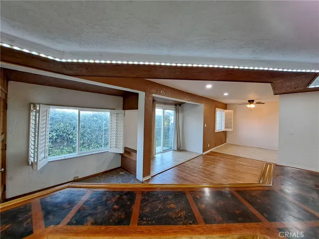 a kitchen with granite countertop a sink and a window