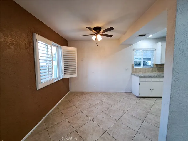 a stove top oven sitting inside of a kitchen