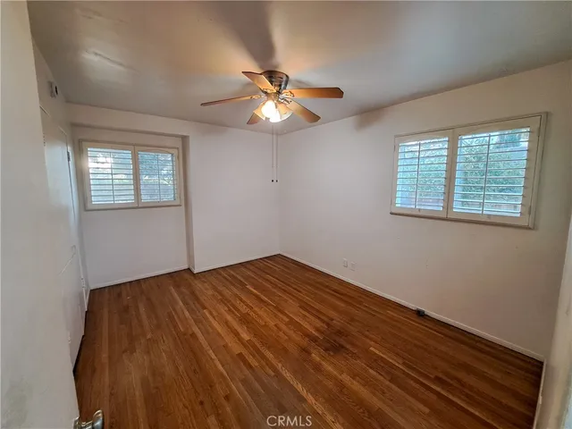 a view of a yard with a large trees
