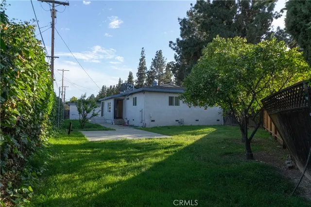 a view of a house with a street
