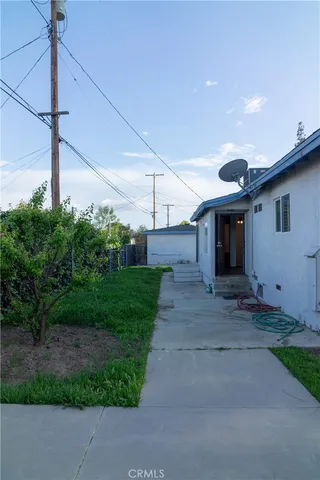a front view of a house with barbeque area