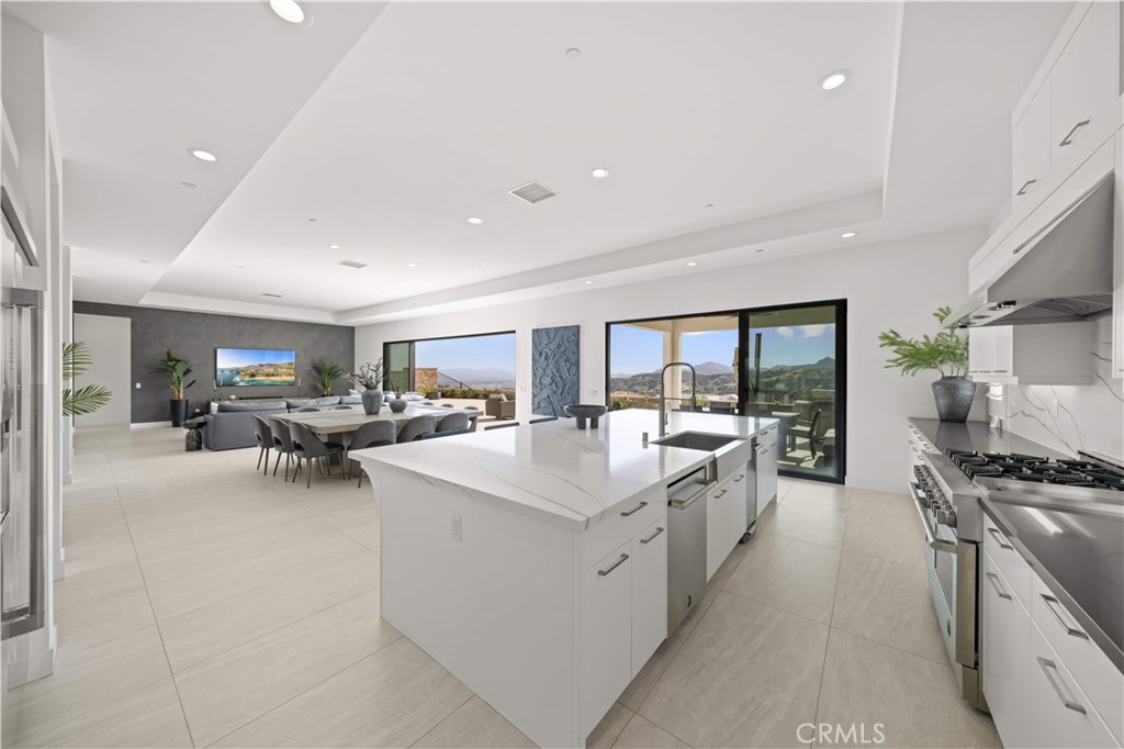 12545 North Silver Spur Court Porter Ranch, CA 91326 - Photo 12 of 22 a large kitchen with stainless steel appliances lots of counter top space