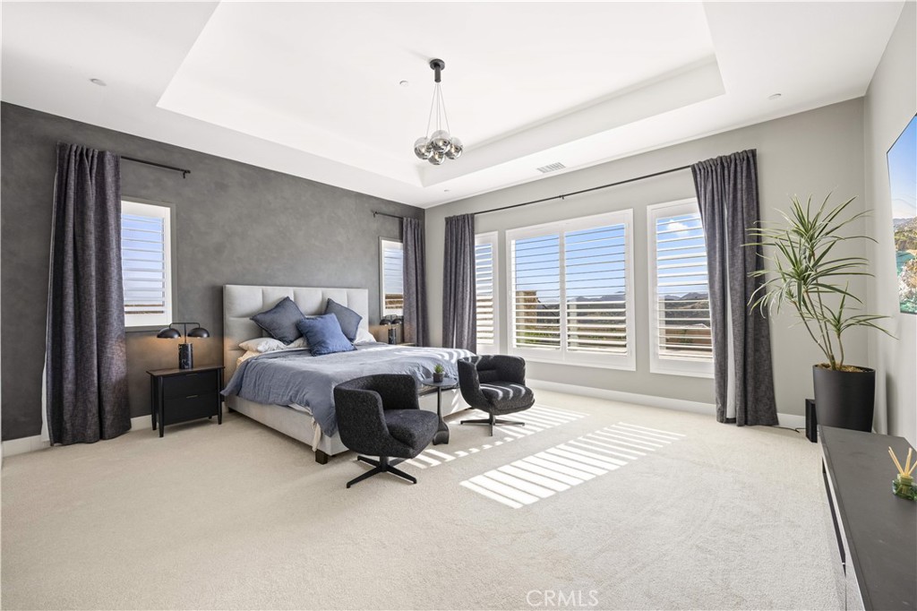 12545 North Silver Spur Court Porter Ranch, CA 91326 - Photo 14 of 22 a bedroom with a bed couch and a large window