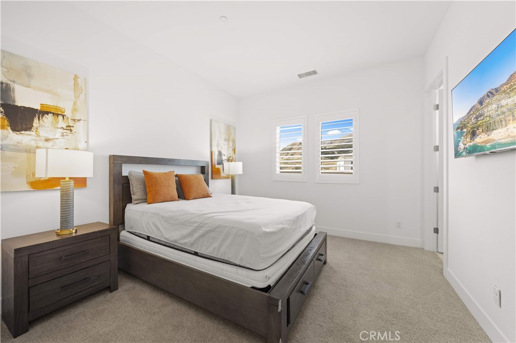 12545 North Silver Spur Court Porter Ranch, CA 91326 - Photo 16 of 22 a bedroom with a bed and a window