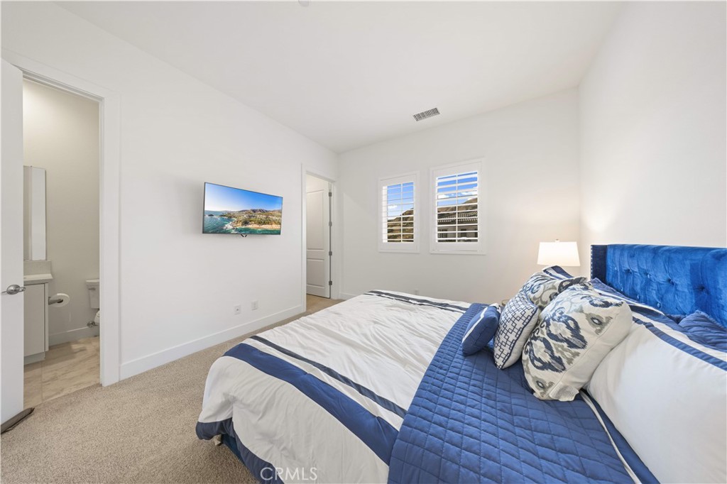 12545 North Silver Spur Court Porter Ranch, CA 91326 - Photo 17 of 22 a bedroom with a bed and a dresser