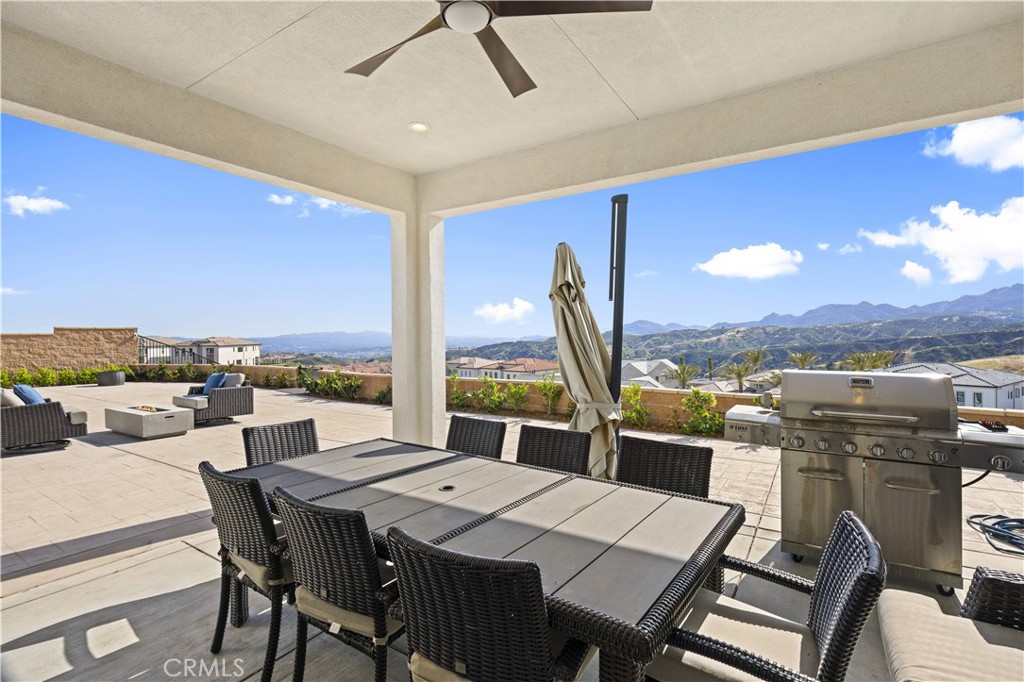 12545 North Silver Spur Court Porter Ranch, CA 91326 - Photo 18 of 22 a view of a dining room with furniture window and outside view