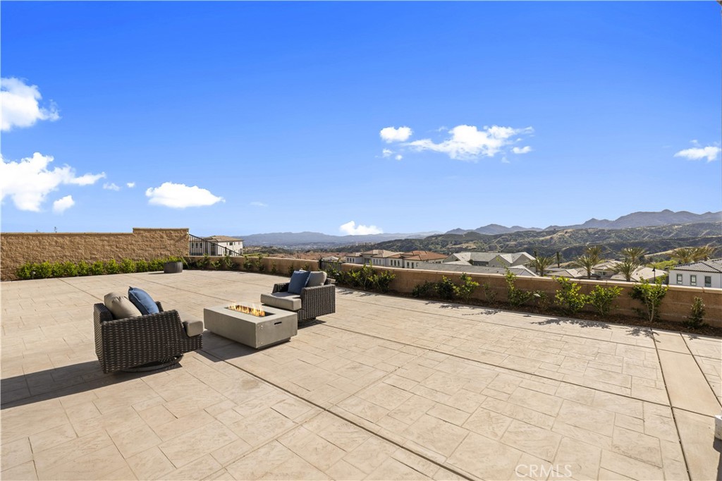 12545 North Silver Spur Court Porter Ranch, CA 91326 - Photo 21 of 22 a view of a terrace with furniture and a city view