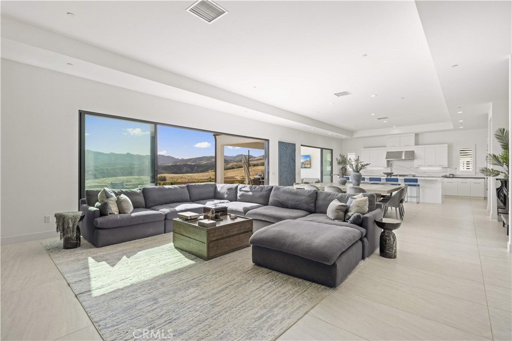 12545 North Silver Spur Court Porter Ranch, CA 91326 - Photo 7 of 22 a living room with furniture and a large window