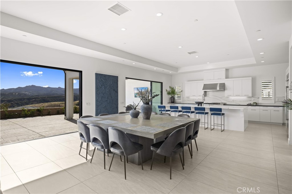 12545 North Silver Spur Court Porter Ranch, CA 91326 - Photo 10 of 22 a view of a dining area with furniture